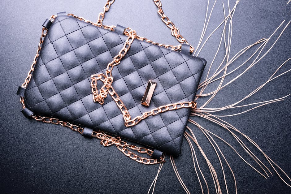 Stylish black quilted purse with gold chain detail, perfect for fashion and elegance.