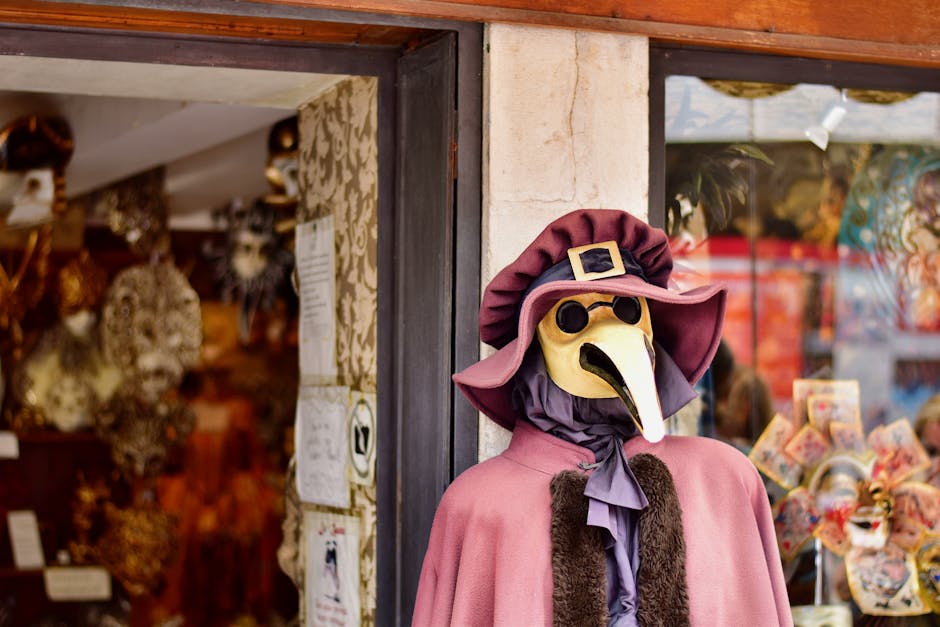 Venetian plague doctor mask displayed outside a souvenir shop in Italy, showcasing historic costume.